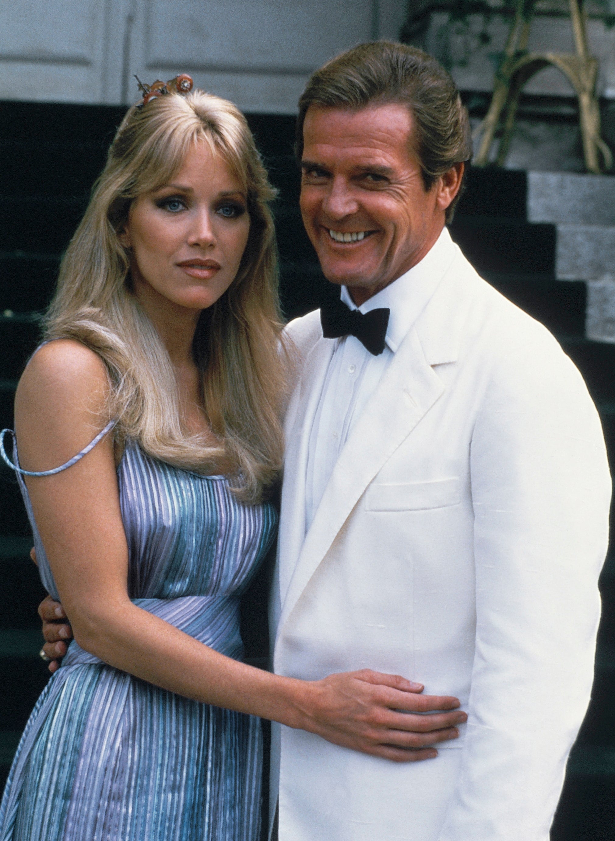 Roberts with Roger Moore outside of Chateau de Chantilly in 1984
