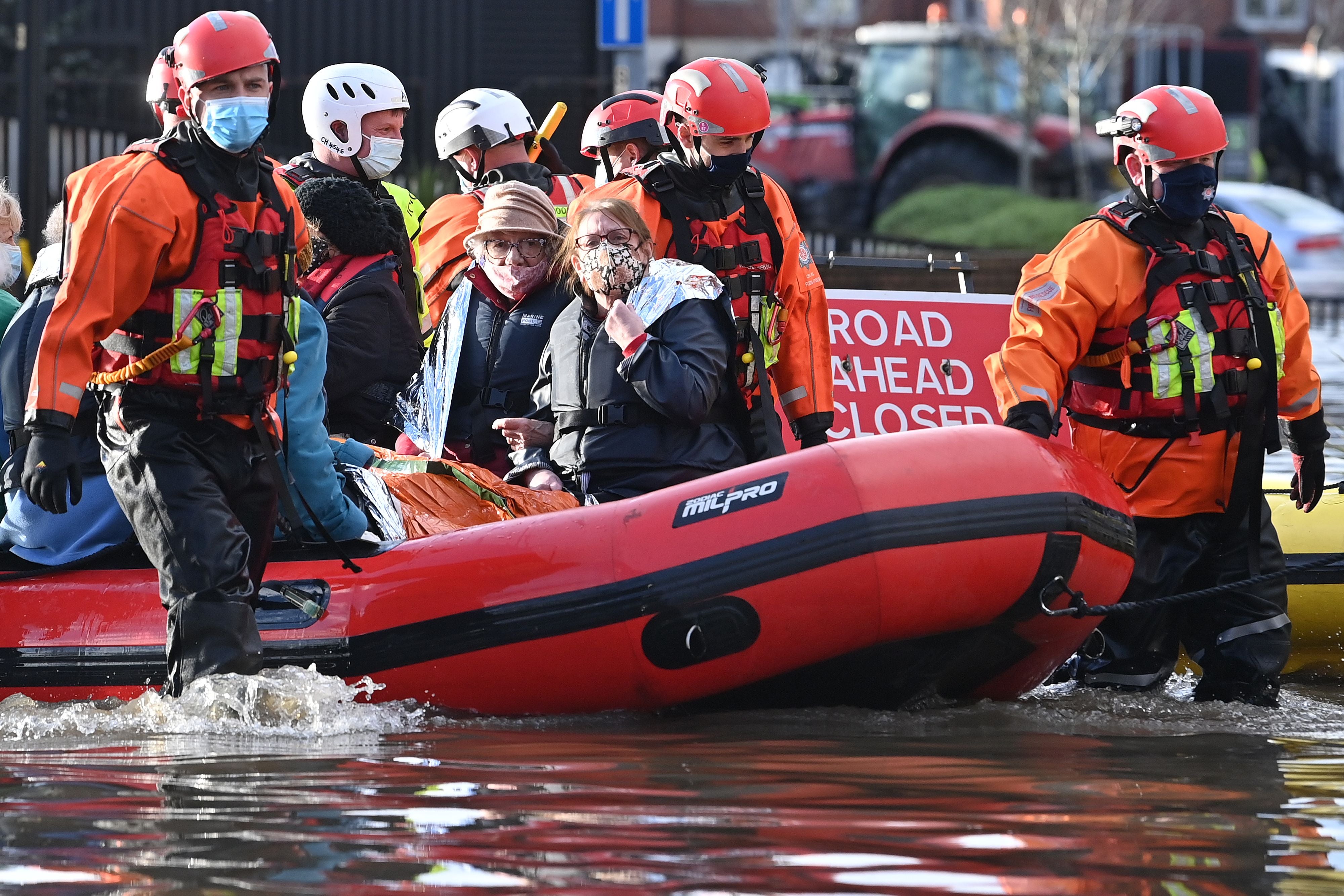 Emergency services evacuate care home residents after they became stranded by flood water, in Northwich
