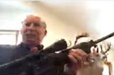 Michigan official shows gun after public meeting criticism