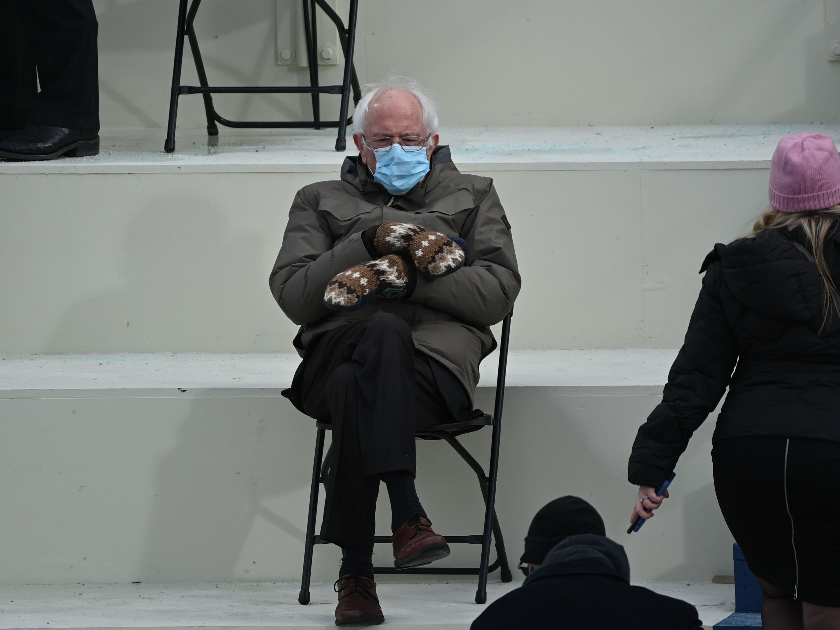 Bernie Sanders sits in the bleachers on Capitol Hill before Joe Biden is sworn in as the 46th US president on 20 January 2021