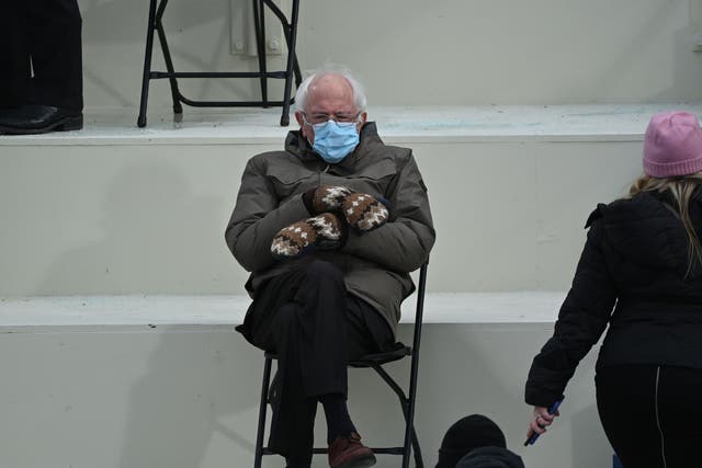 Bernie Sanders sits in the bleachers on Capitol Hill before Joe Biden is sworn in as the 46th US president on 20 January 2021