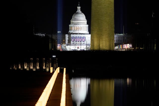 <p>The US Capitol Building is reflected in the Lincoln Memorial Reflecting Pool during a televised ceremony on January 20, 2021 in Washington, DC</p>