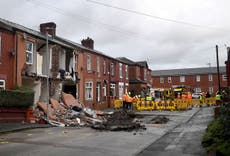Manchester sinkhole: Houses collapse and car swallowed as street suddenly opens up