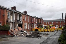 Manchester sinkhole: Houses collapse and car swallowed as street suddenly opens up