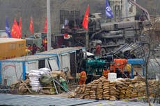 At least 14 more days to reach trapped Chinese miners, rescuers say