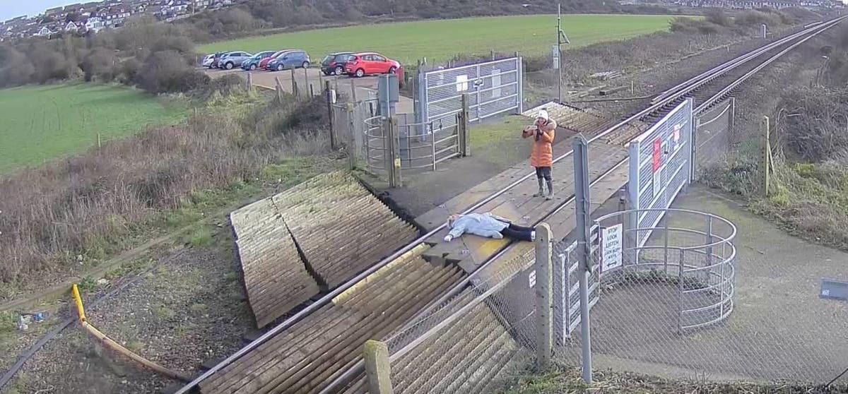 ‘Unthinkably stupid’: Woman filmed lying across railway tracks in East Sussex