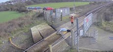 ‘Unthinkably stupid’: Woman filmed lying across railway tracks in East Sussex