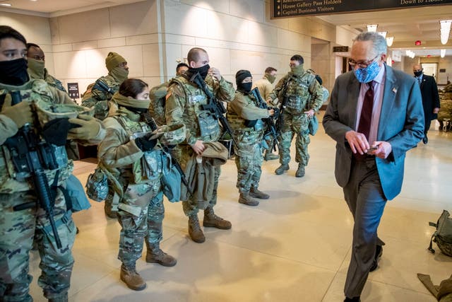 Senate Majority Leader Chuck Schumer greets National Guard soldiers