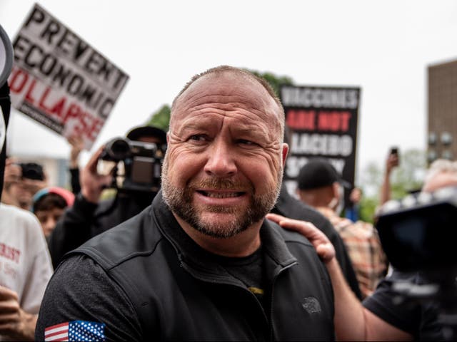 <p>Infowars founder Alex Jones interacts with supporters at the Texas State Capital building on 18 April 2020 in Austin, Texas</p>