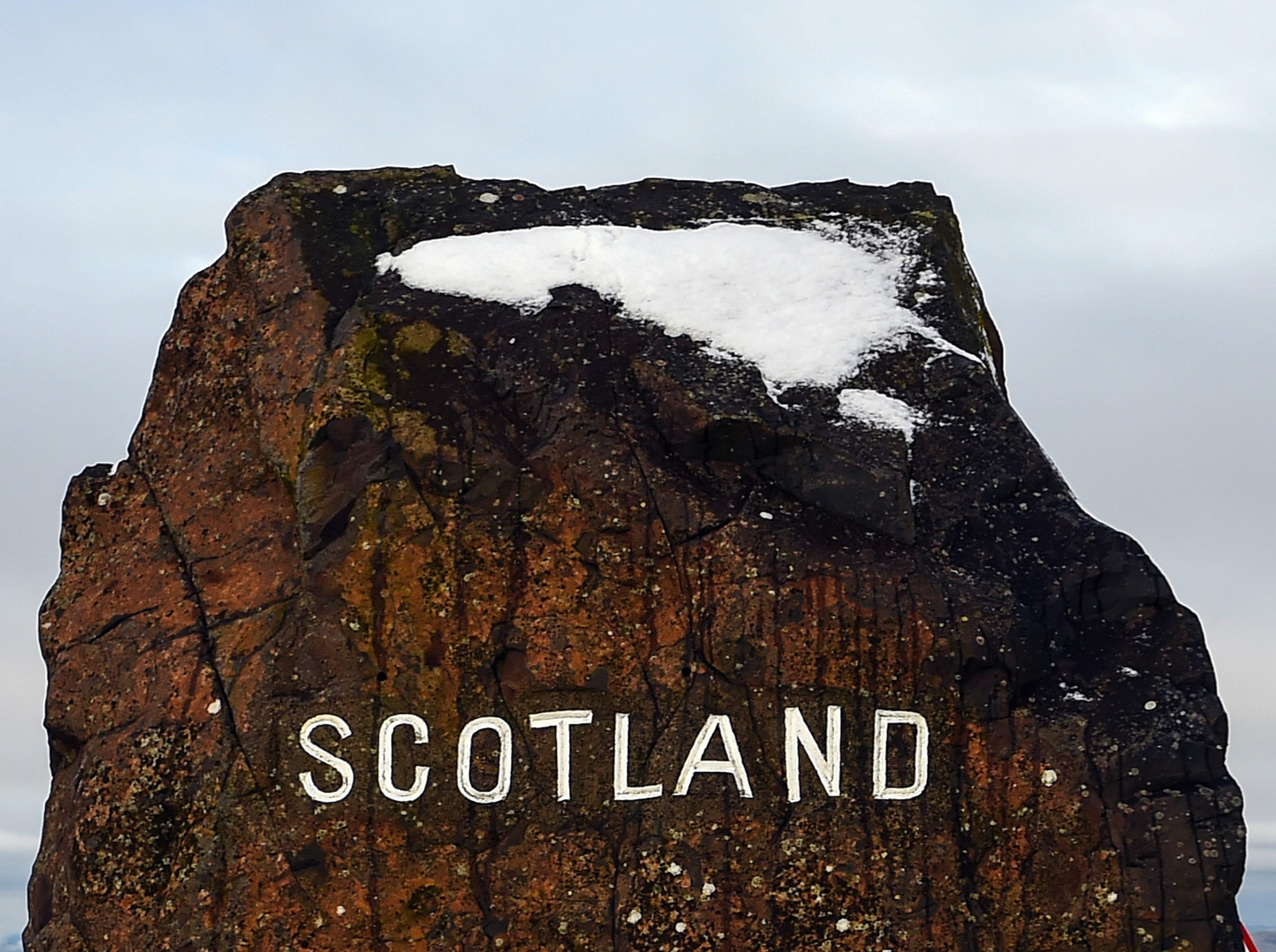 Snow is seen atop a rock on the border between England and Scotland near Jedburgh on 31 December