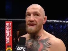 McGregor reacts after being knocked out by Poirier