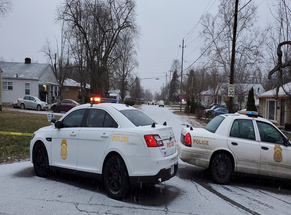 <p>Indianapolis Metropolitan Police Department at the scene on Sunday where five people, including a pregnant woman, were shot dead</p>