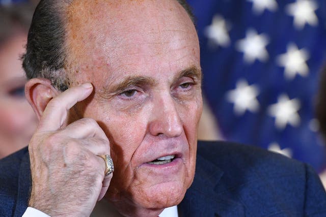 <p>Rudy Giuliani speaks during a press conference at the Republican National Committee headquarters in Washington, DC, on 19 November 2020</p>