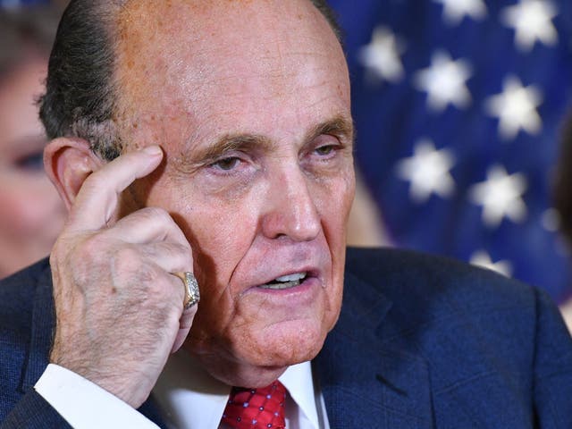 <p>Rudy Giuliani speaks during a press conference at the Republican National Committee headquarters in Washington, DC, on 19 November 2020</p>