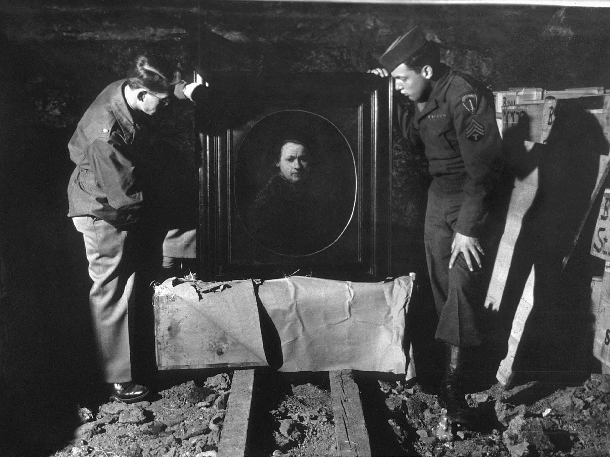 A US soldier inspects priceless art taken from Jews by the Nazis and stashed in the Heilbronn salt mines in Germany, 3 May 1945. The treasures were uncovered by allied forces after the defeat of Nazi Germany