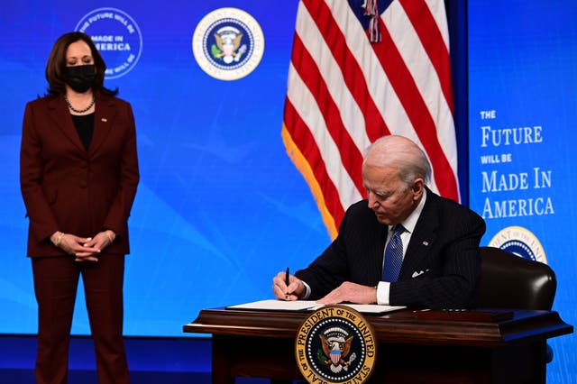 <p>President Joe Biden with Vice President Kamala Harris signs a “Made in America” Executive Order, to increase the amount of federal spending that goes to US companies</p>