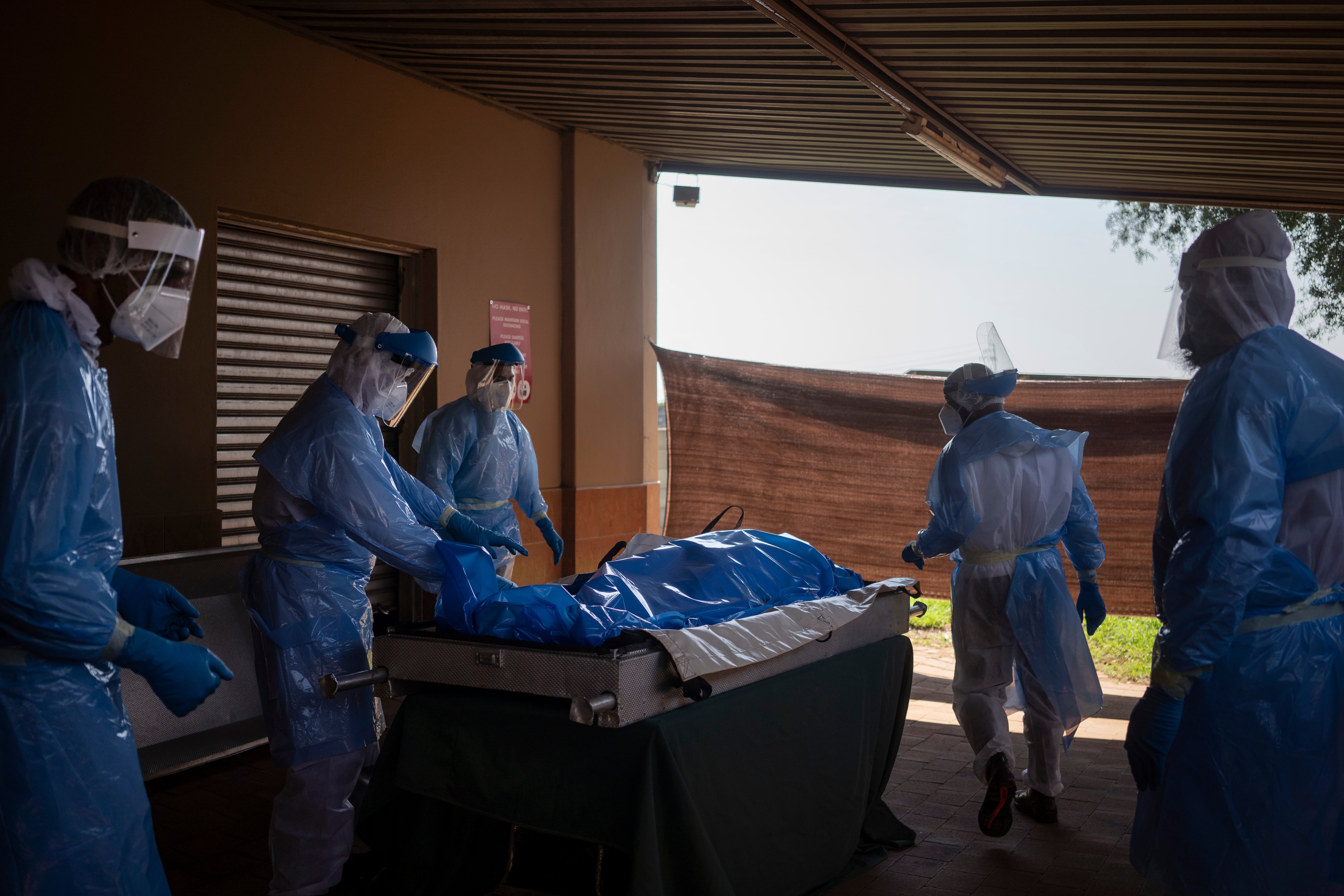 South African Muslim group safely buries its virus dead Men COVID