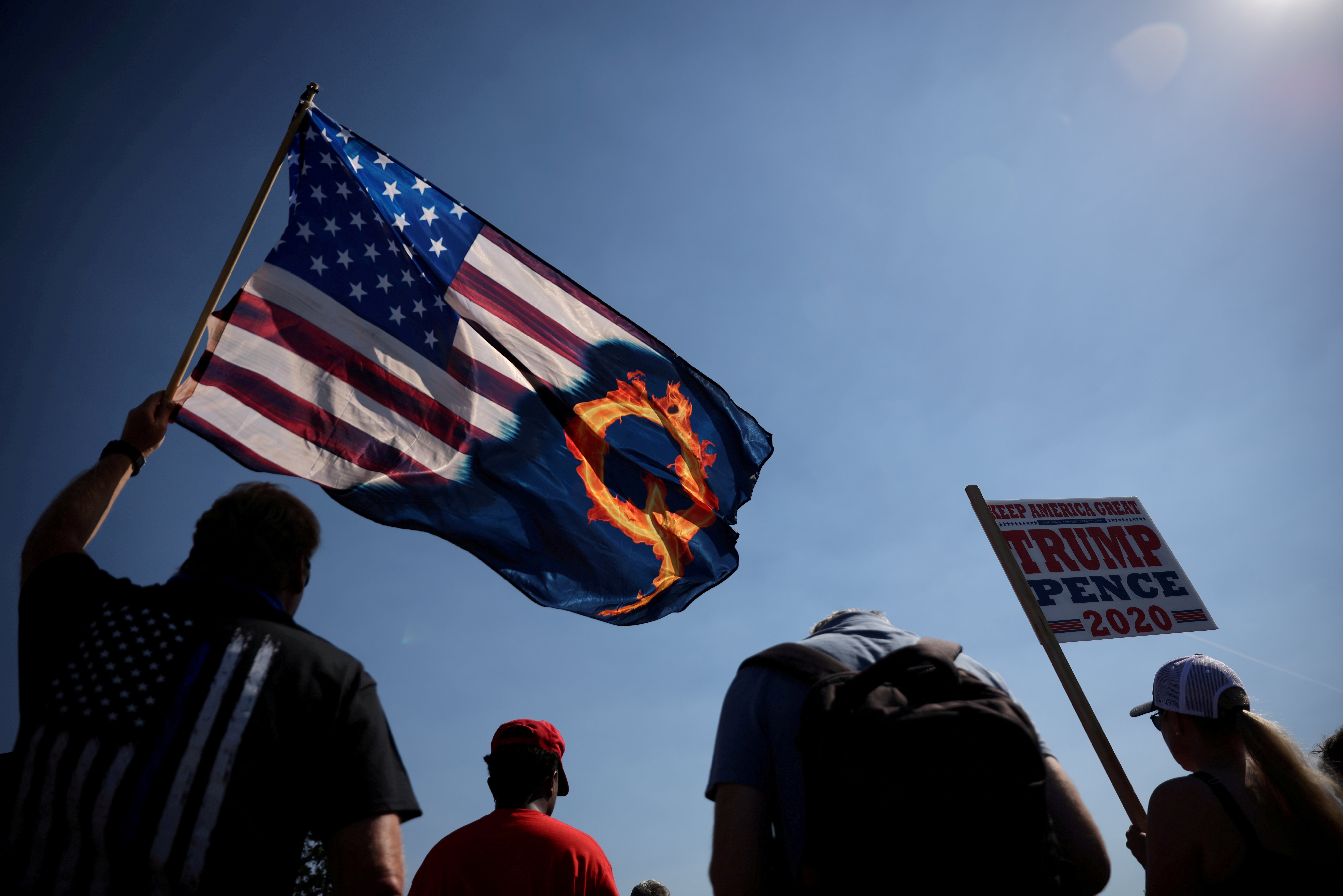 QAnon supporters – mostly white, right-wing Americans – began finding each other in real life, holding demonstrations in city streets