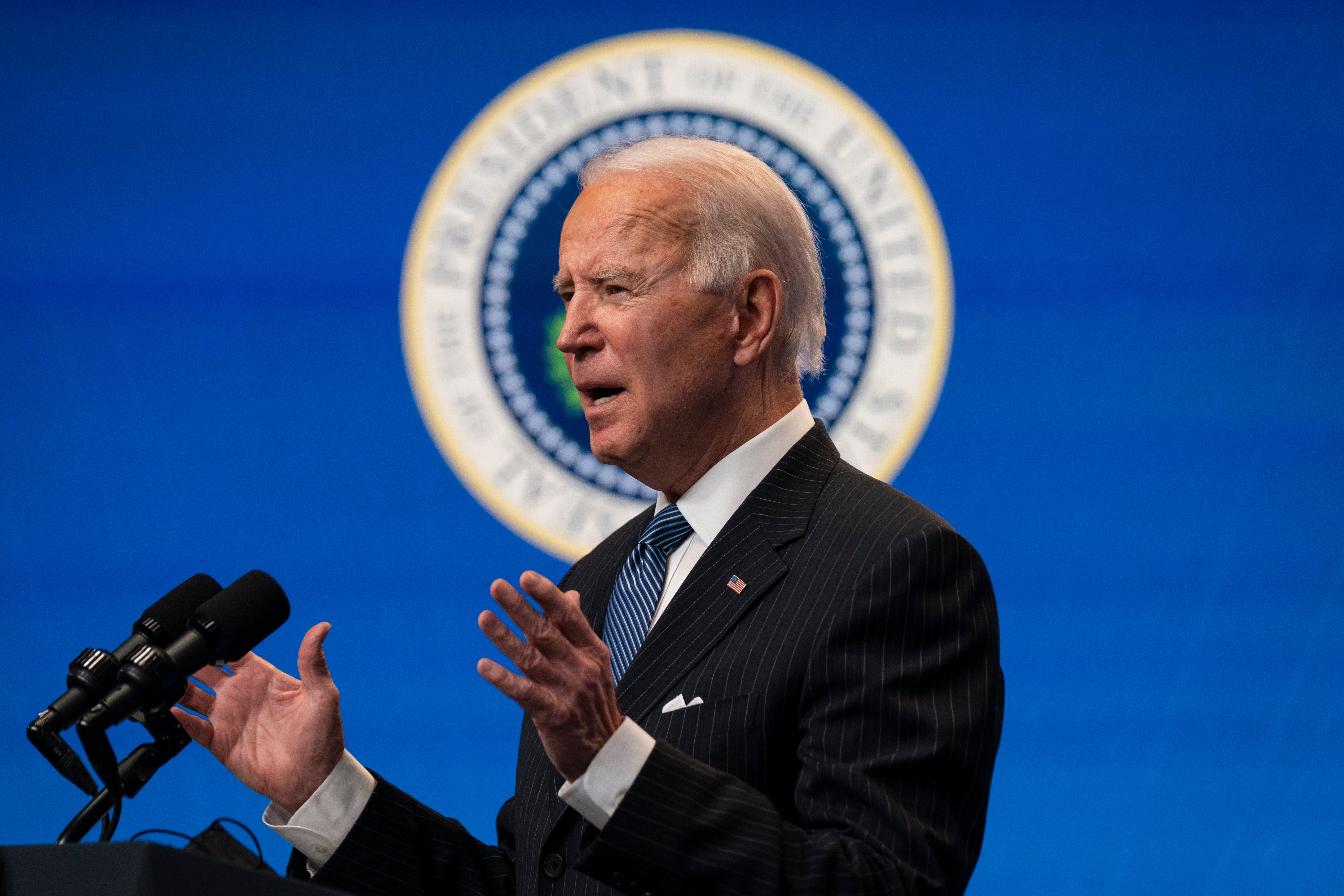 President Joe Biden answers questions from reporters in the South Court Auditorium at the White House