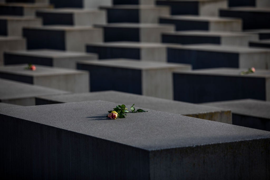 Roses are placed on the Holocaust Memorial on International Holocaust Remembrance Day, 2021, in Berlin, Germany. Today marks the 76th anniversary of the liberation of the Auschwitz