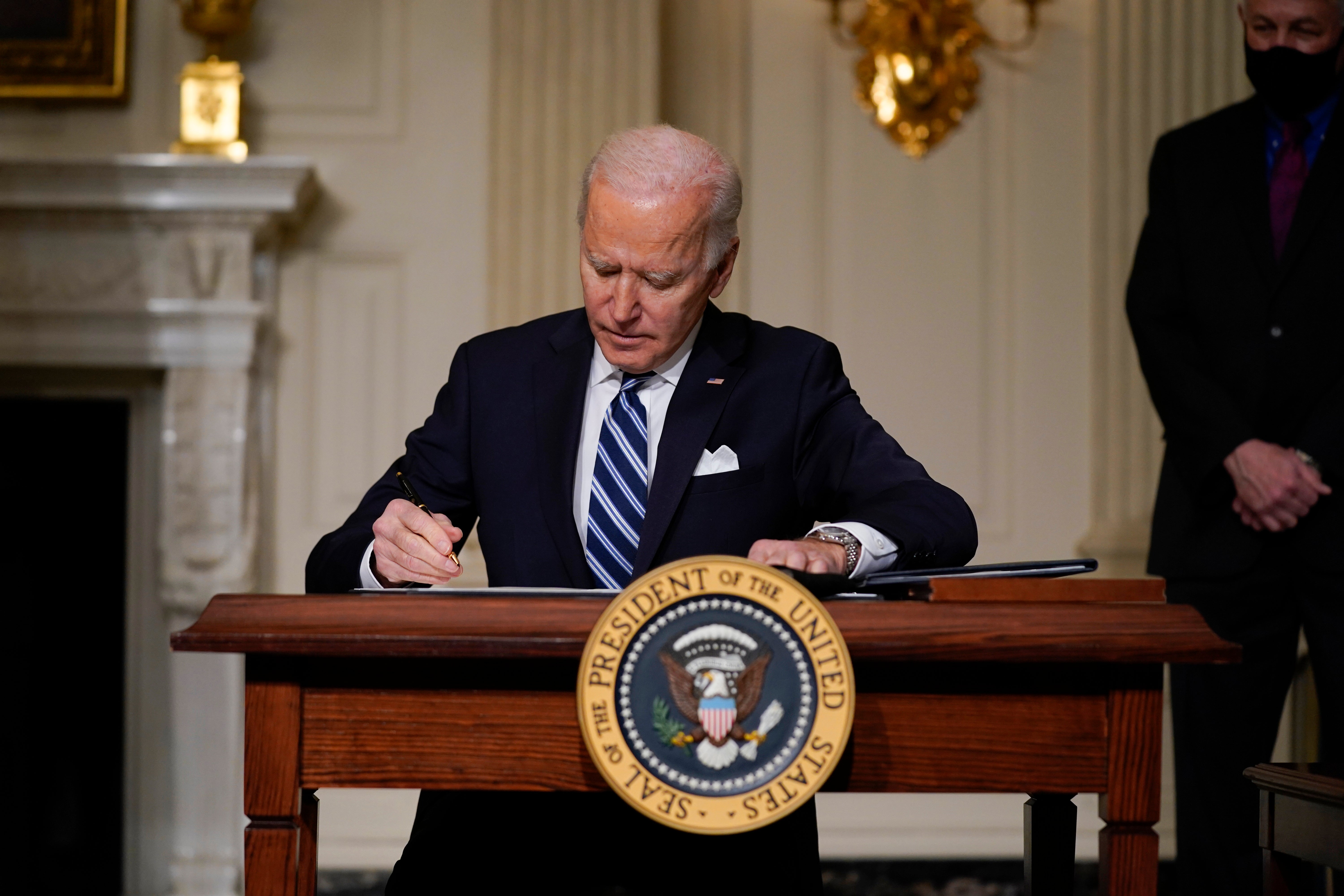 Biden signs an executive order on climate change on Wednesday