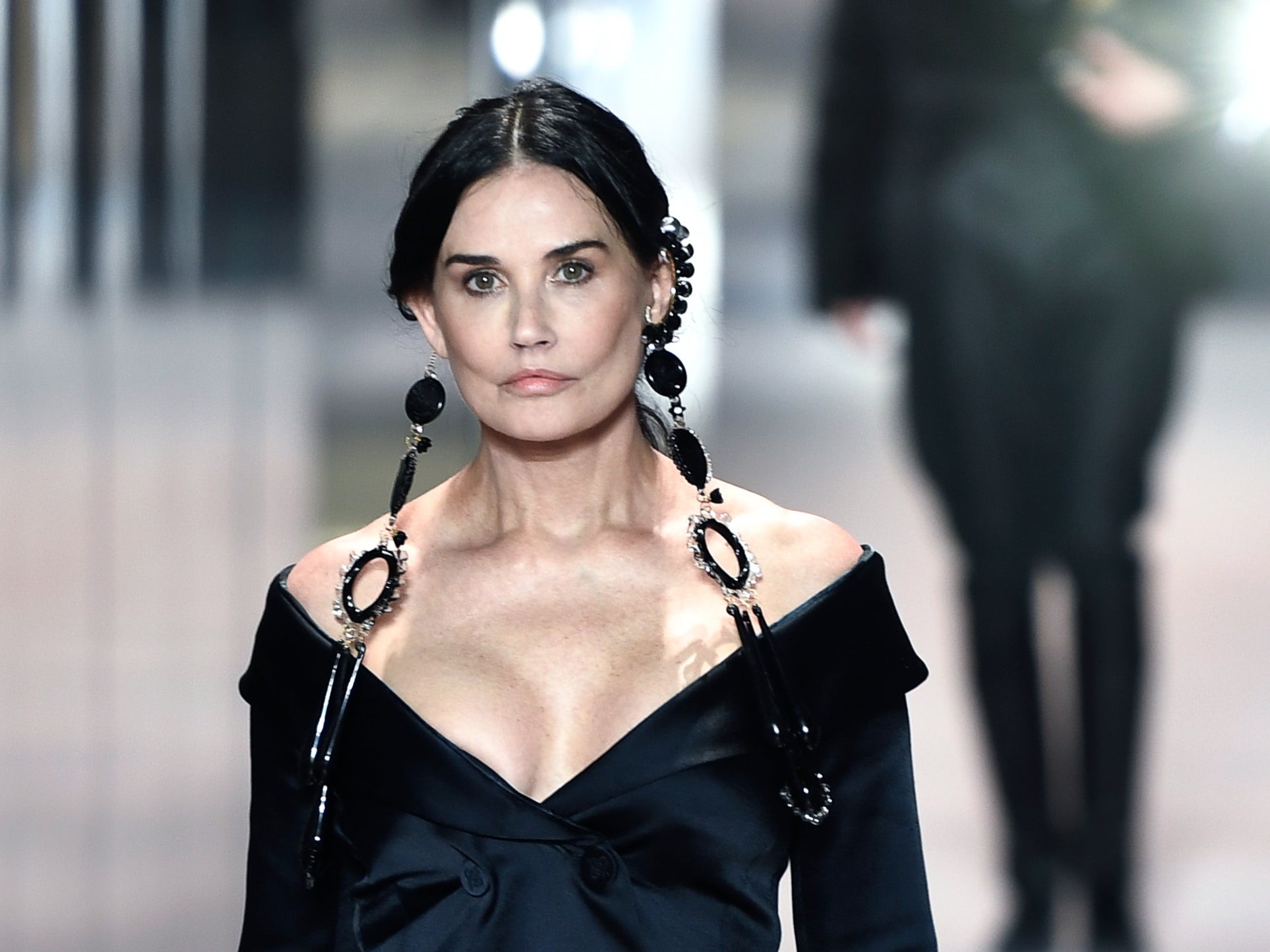 Demi Moore makes surprise runway appearance at Paris Haute Couture Fashion Week.