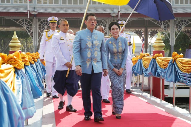 <p>Thai King Maha Vajiralongkorn, center, and Sineenat Wongvajirabhakdi in Bangkok on her birthday on 26 January, 2020&nbsp;</p>