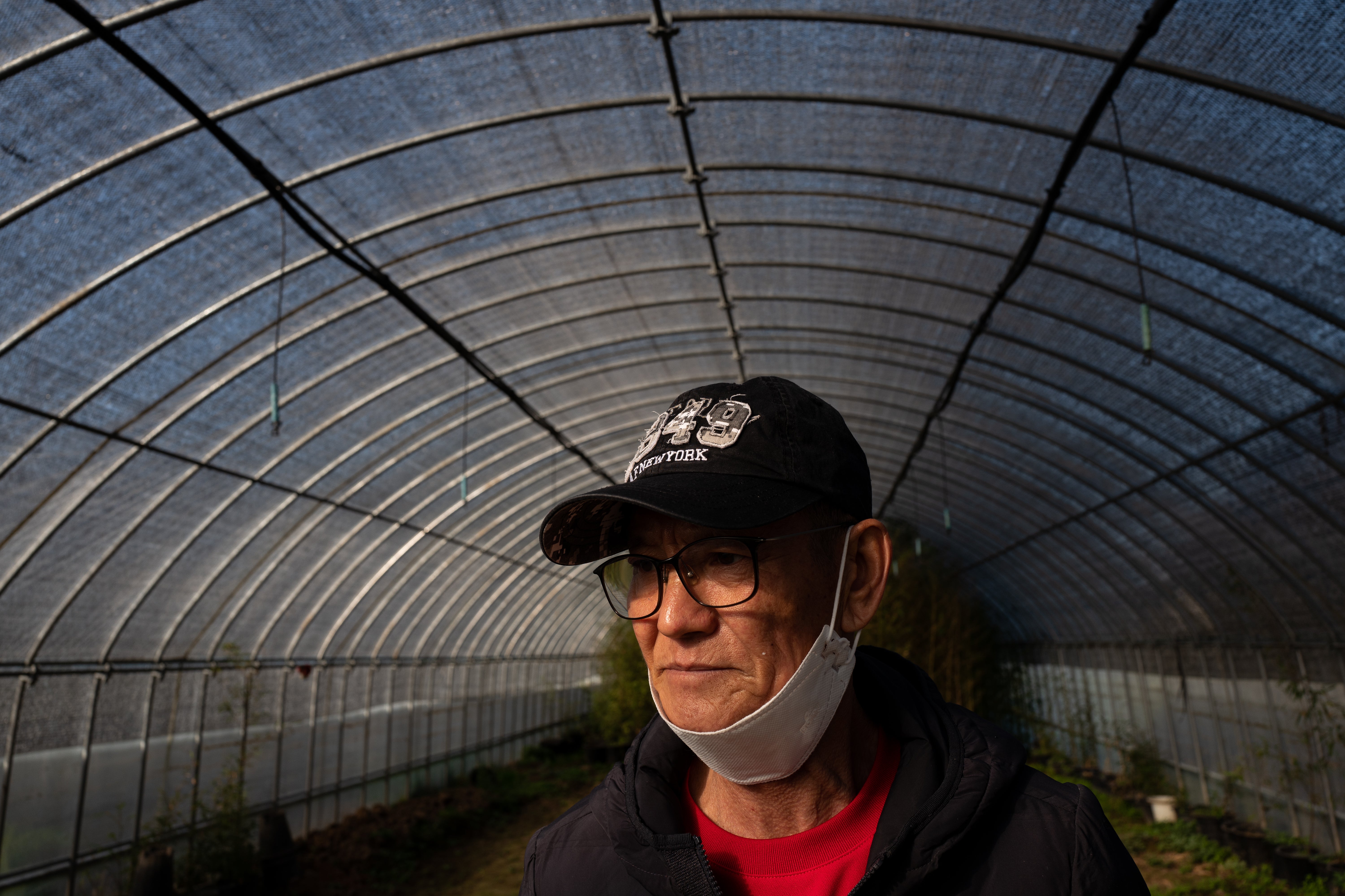 North Korean defector Han Hong-geun stares at something on his farm in Seosan city, Chungcheongnam-do province, South Korea