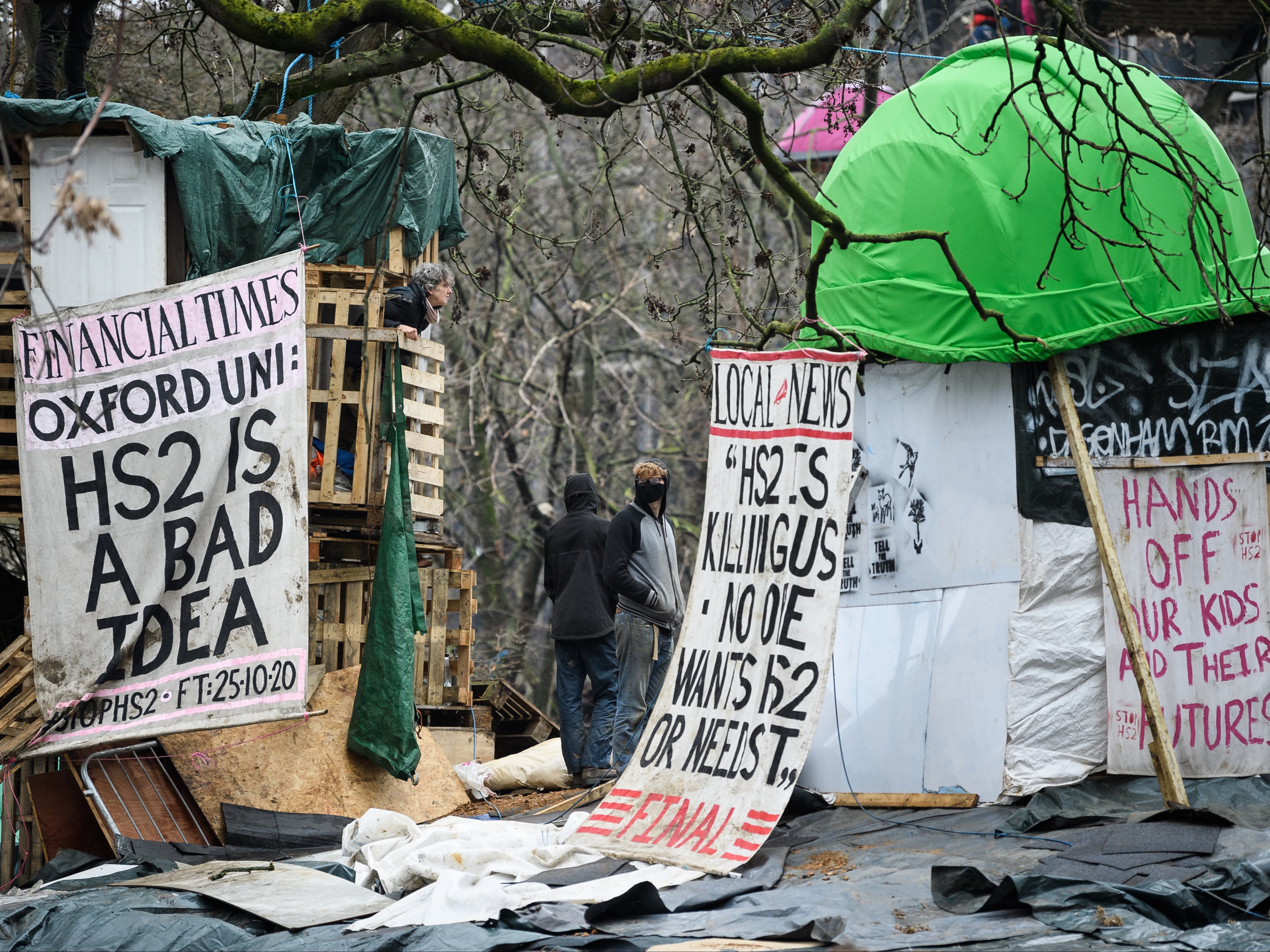 Environmental protestors remain in their positions as bailiffs and police officers attempt to clear the Euston Square Gardens camp