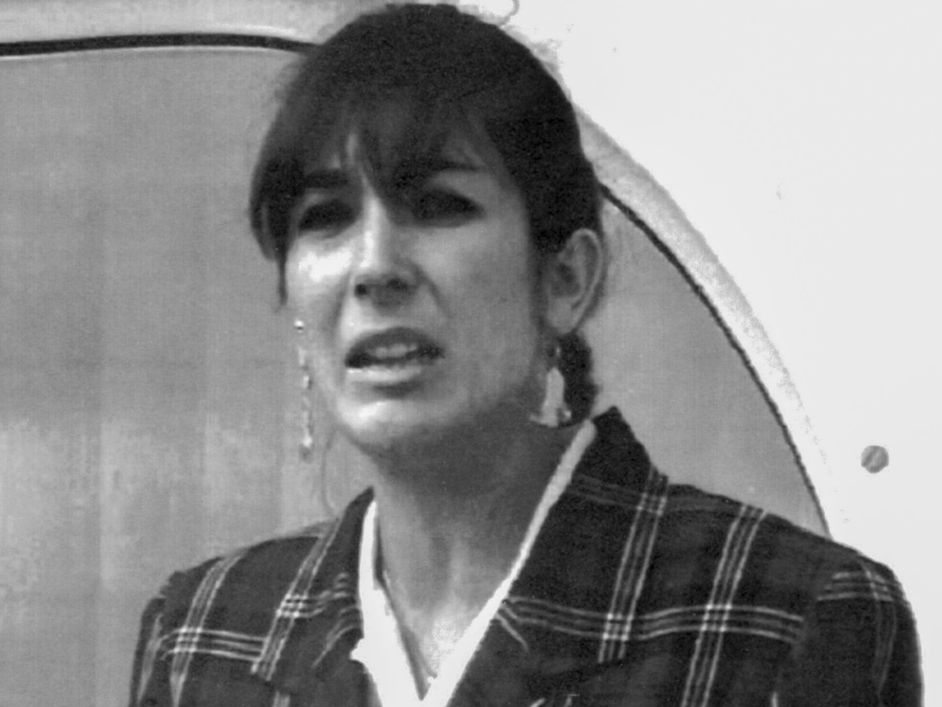 Maxwell reading a press statement on her father’s death in Spain in November 1991
