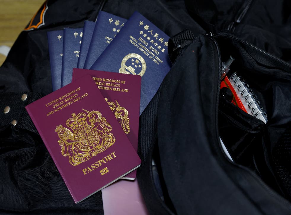 <p>British National Overseas passports (BNO) and Hong Kong Special Administrative Region of the People's Republic of China passports sit on top of the Lai family's baggage before they emigrate to Scotland</p>