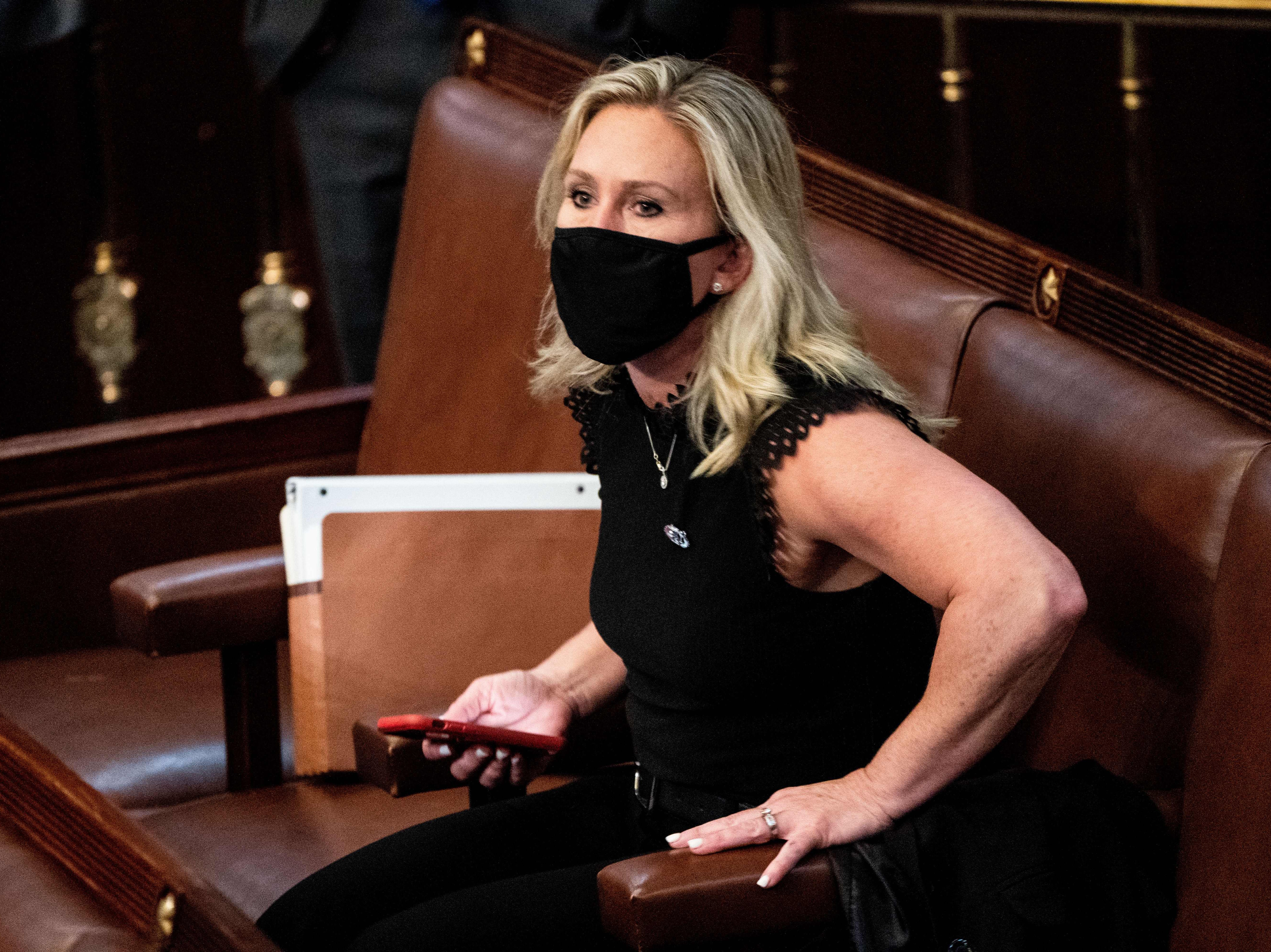 Marjorie Taylor Greene sits in the House Chamber on 6 January 2021.