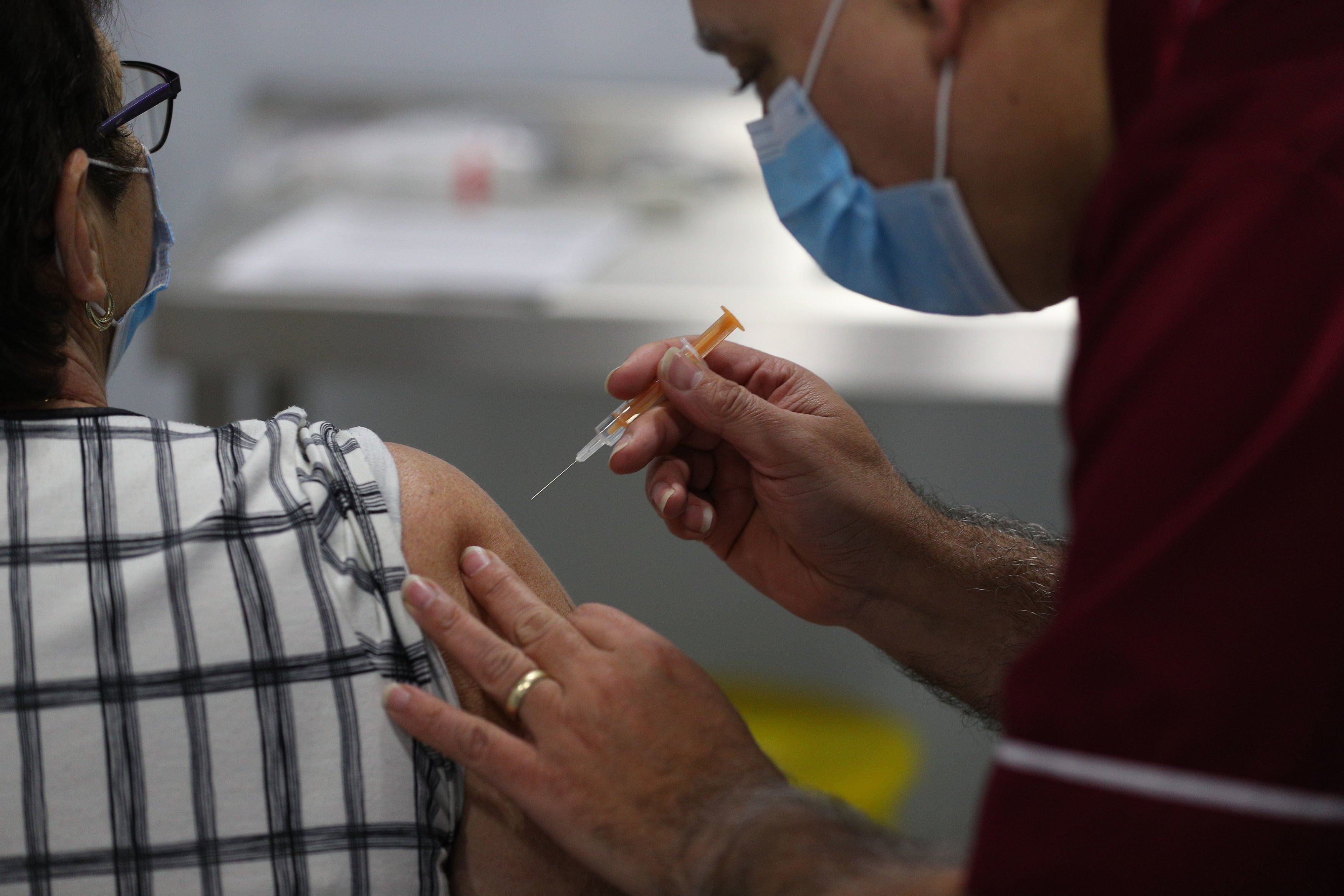 A person receives a dose of the Oxford-AstraZeneca vaccine in Blackpool