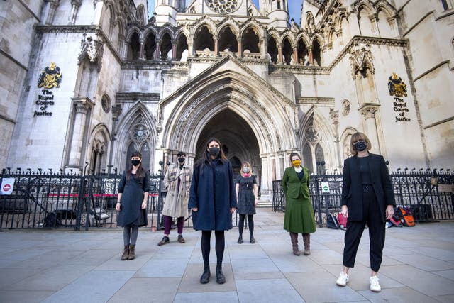 Six members of the so-called Stansted 15 (left to right) May MacKeith, Ben Smoke, Helen Brewer, Emma Hughes, Mel Evans, and Ruth Potts outside the Royal Courts of Justice in London on 24 November 2020