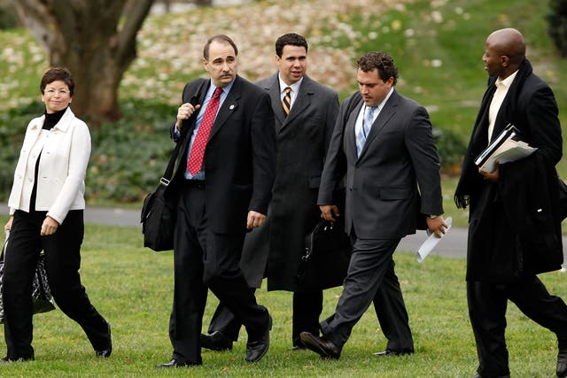 Speechwriter Cody Keenan walk across the White House lawn with other advisors to President Obama in December 2009. 