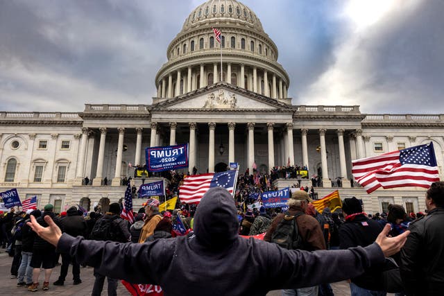 Pro-Trump protesters gather in front of the US Capitol Building on 6 January, 2021 in Washington, DC. A California man has been arrested in connection with the riots.