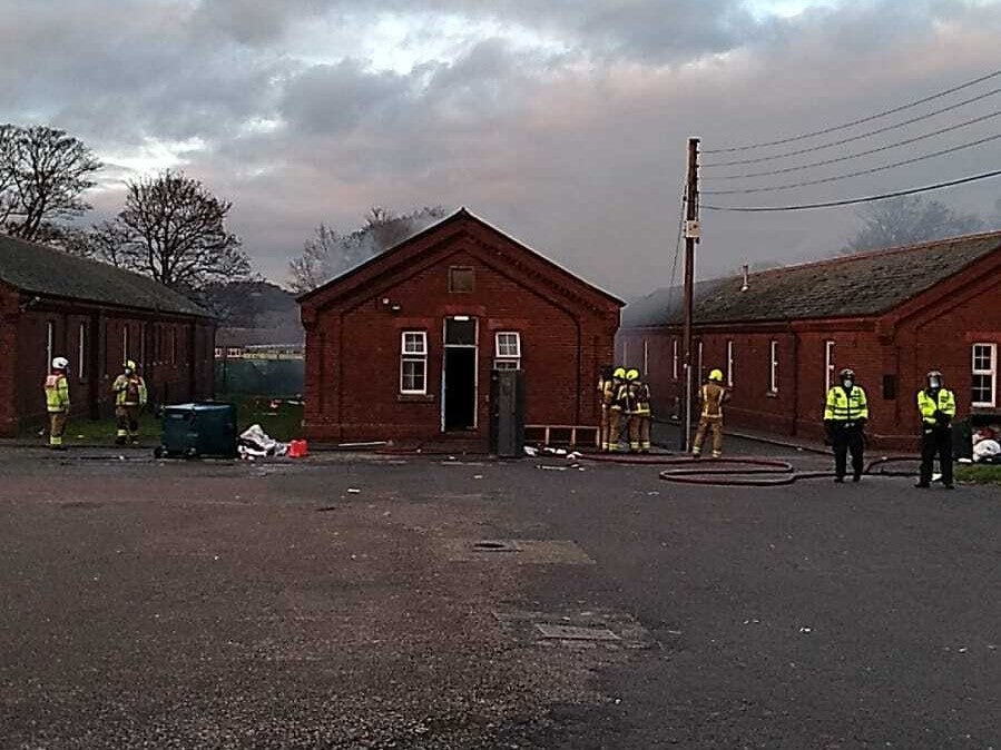Firefighters and police officers were sent to Napier Barracks after the blaze broke out on Friday