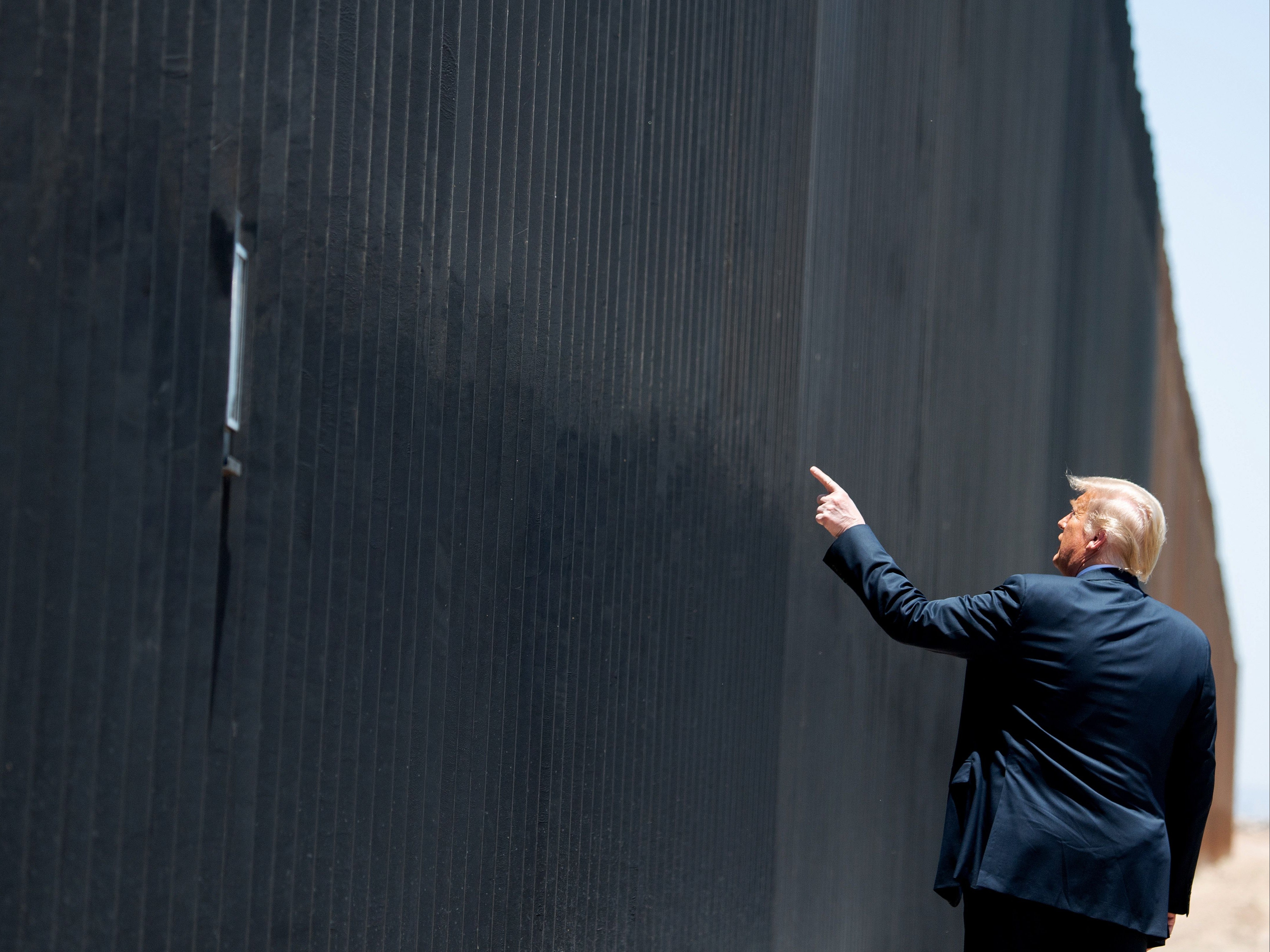 Donald Trump at the border wall with Mexico last year