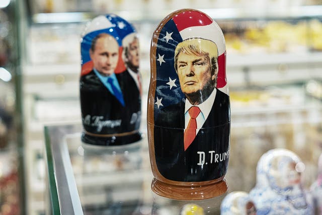A Moscow shop display shows Matryoshka dolls featuring Vladimir Putin and Donald Trump.