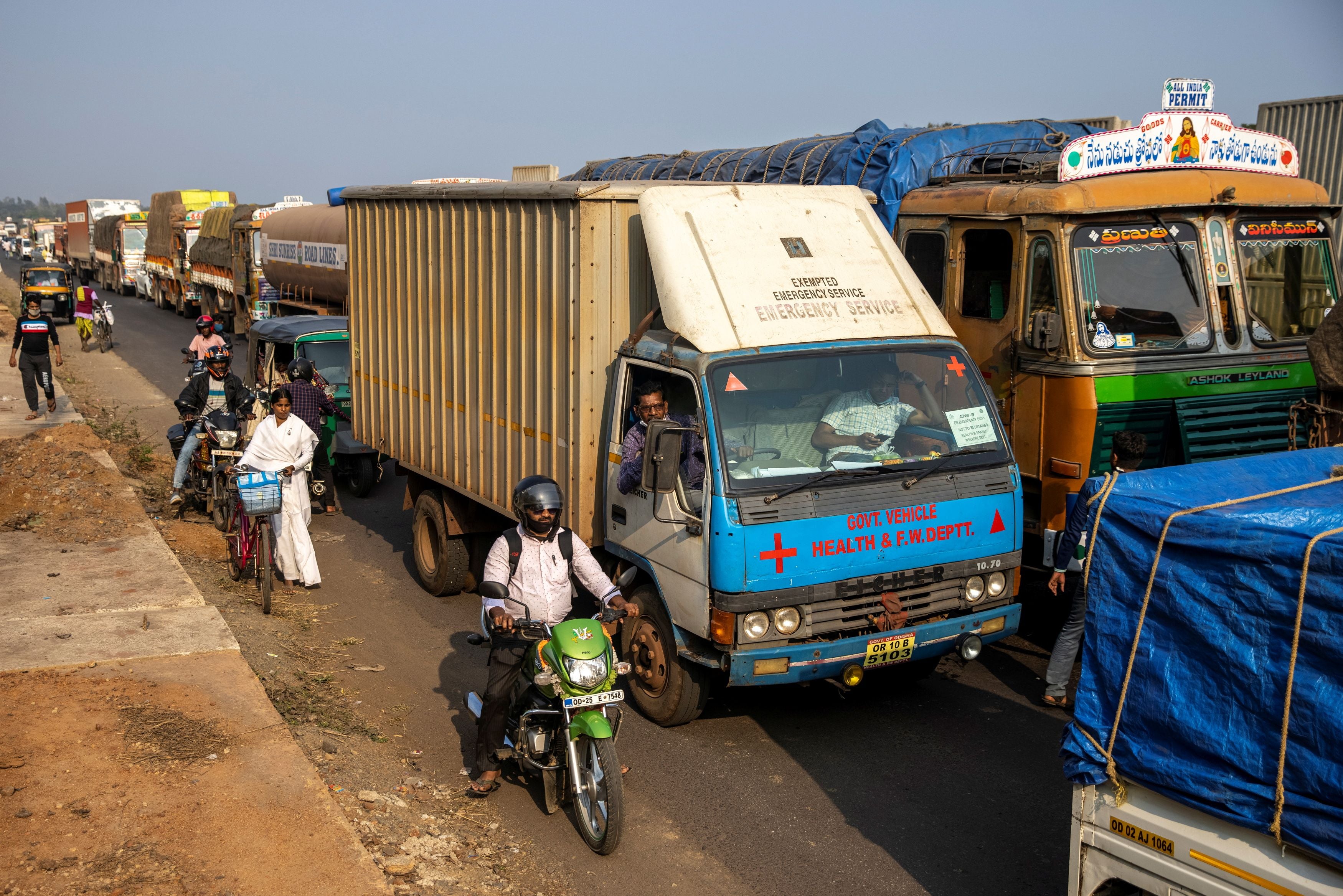 A health department truck waits in a traffic jam as it transports the vaccine