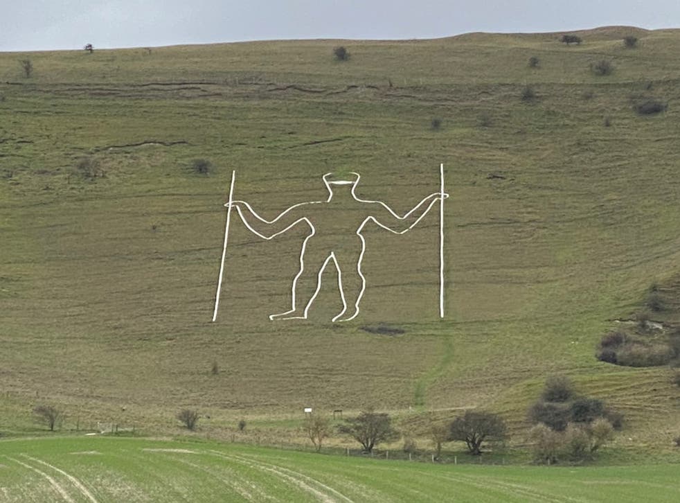 <p>The mask was painted on the figure carved into the chalk hillside</p>