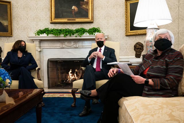 President Joe Biden, middle, meets with Vice President Kamala Harris, left, and Treasury Secretary Janet Yellen about how to move forward amid the coronavirus pandemic.