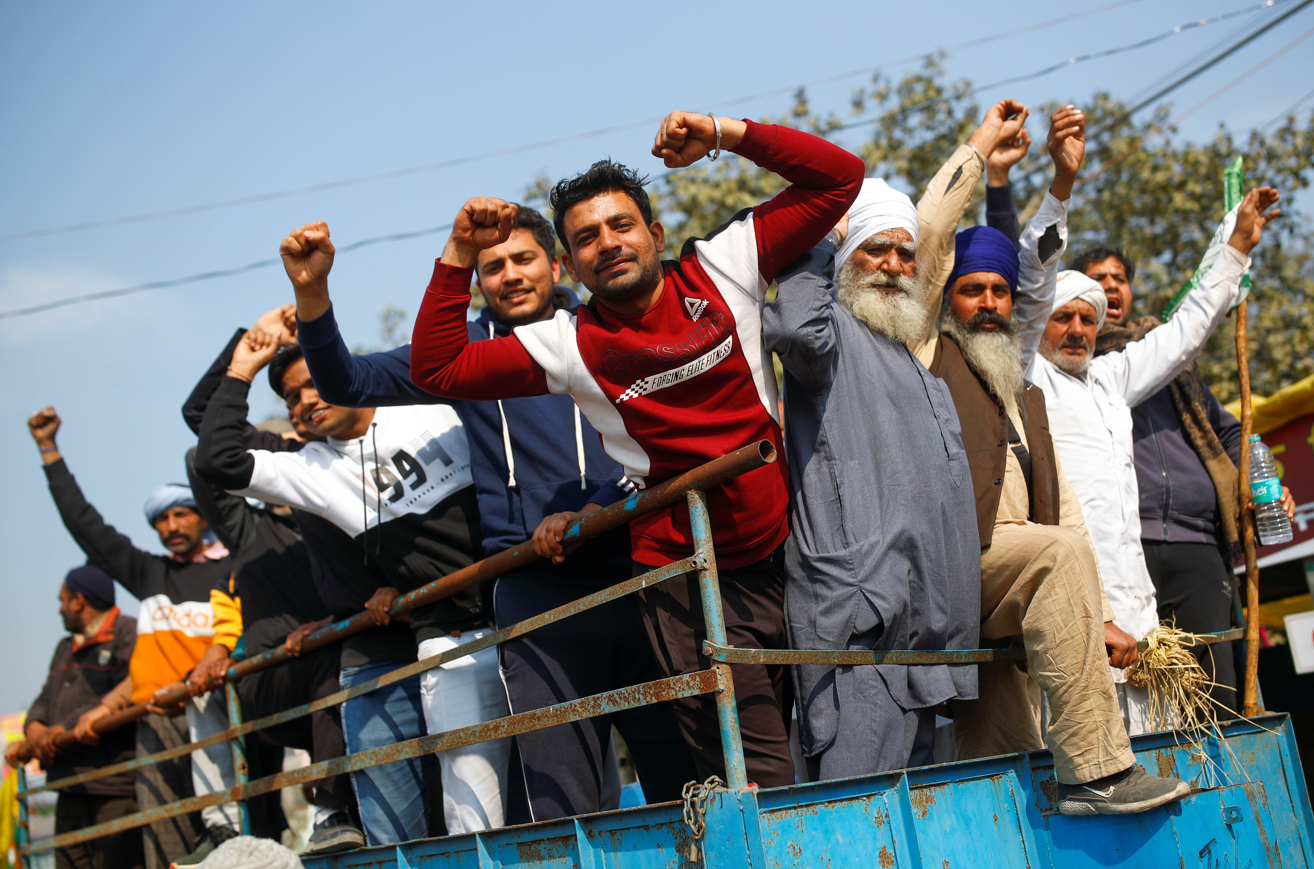 FILE PHOTO: Farmers arrive at the site of a protest against the farm laws at the Singhu border of Delhi on Saturday. REUTERS