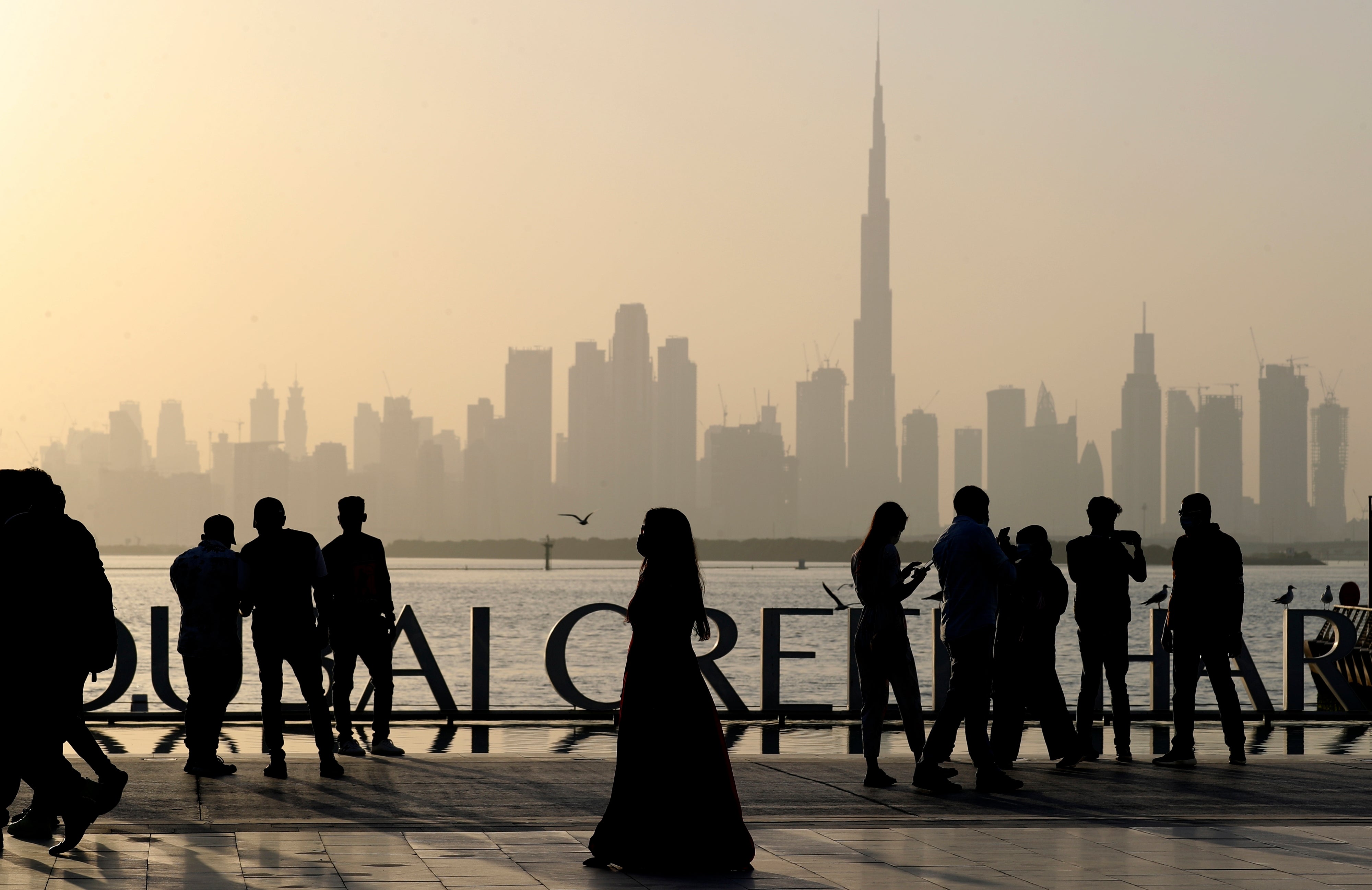 Locals and tourists enjoy the Dubai skyline including the world tallest tower, Burj Khalifa