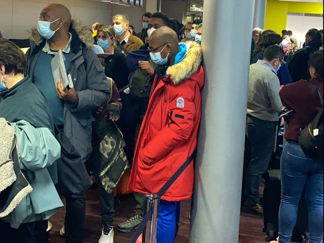 Waiting game: Passengers booked on Air France flight 406 queuing at Paris Charles de Gaulle airport