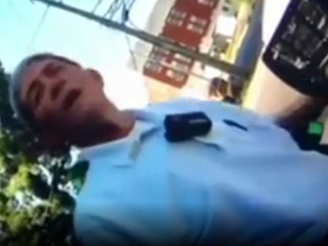 Hamilton Police Department Gene Allmond in body camera footage in which he and patrolman John Brooks have a racist conversation. Both men were forced out of the police department.