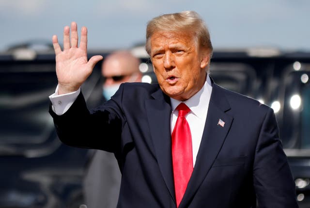 <p>Donald Trump waves as he arrives at Palm Beach International Airport in West Palm Beach, Florida, on 20 January 2021</p>