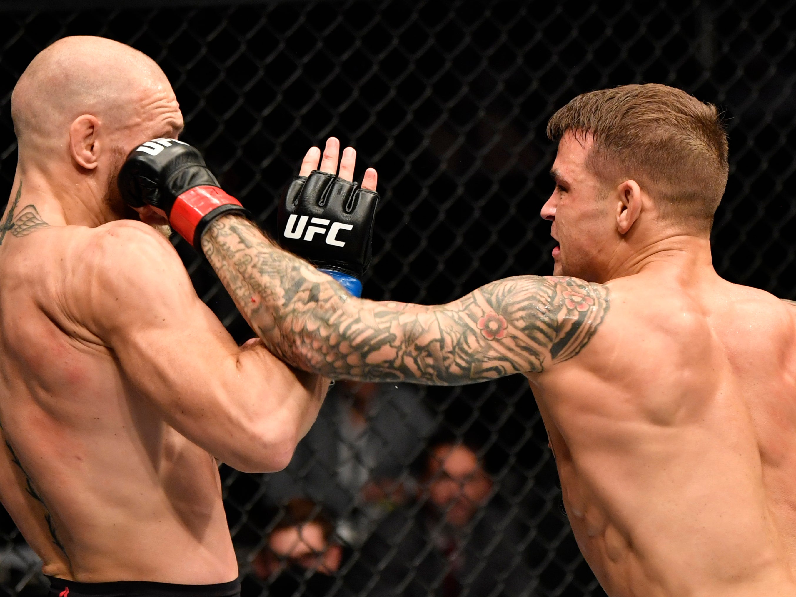 Dustin Poirier (right) knocked out Conor McGregor in their rematch last month