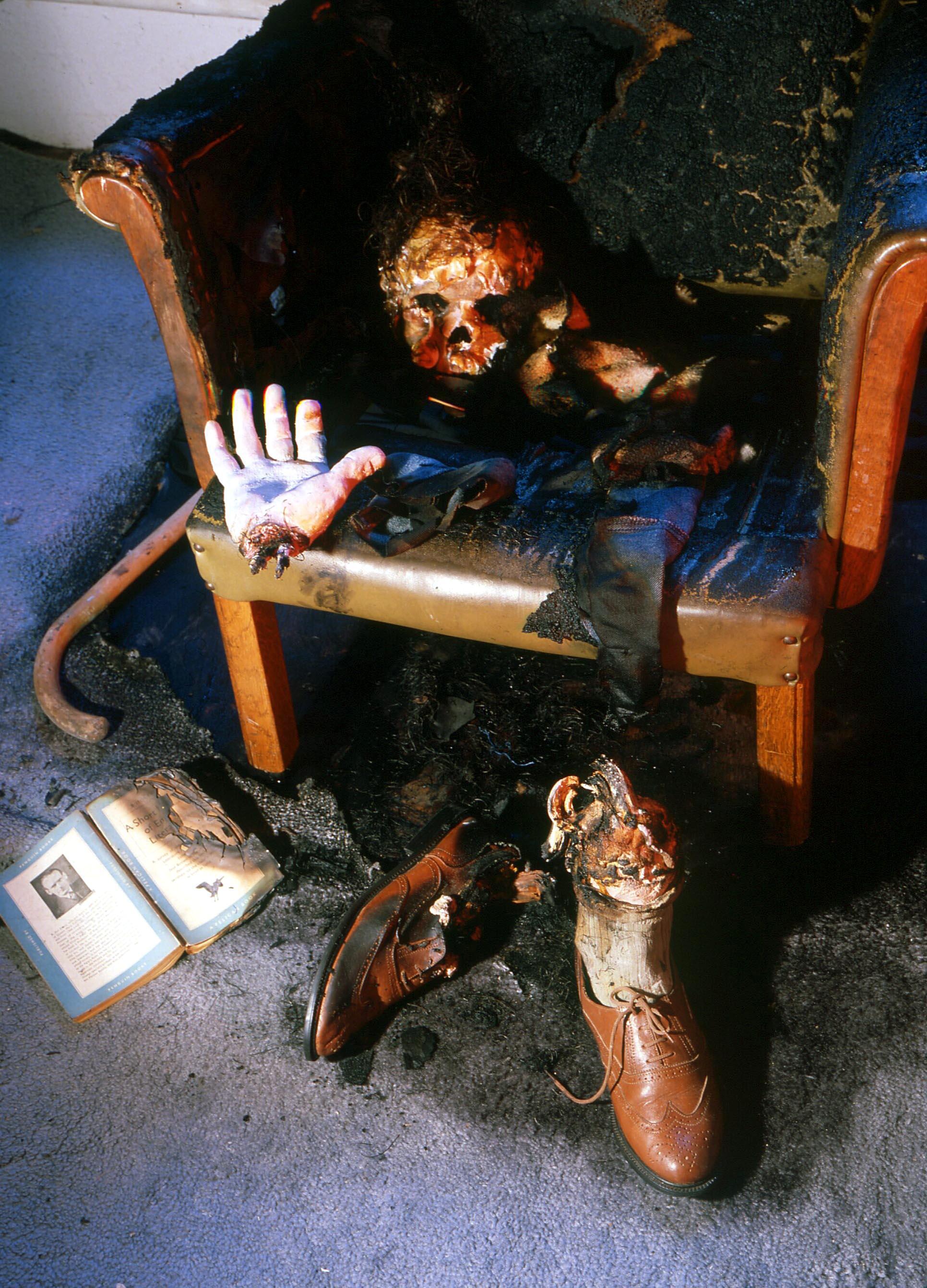 It is common in SHC epiodes for a few physical fragments of the body to remain, as illustrated in this studio shot of a burned-out chair