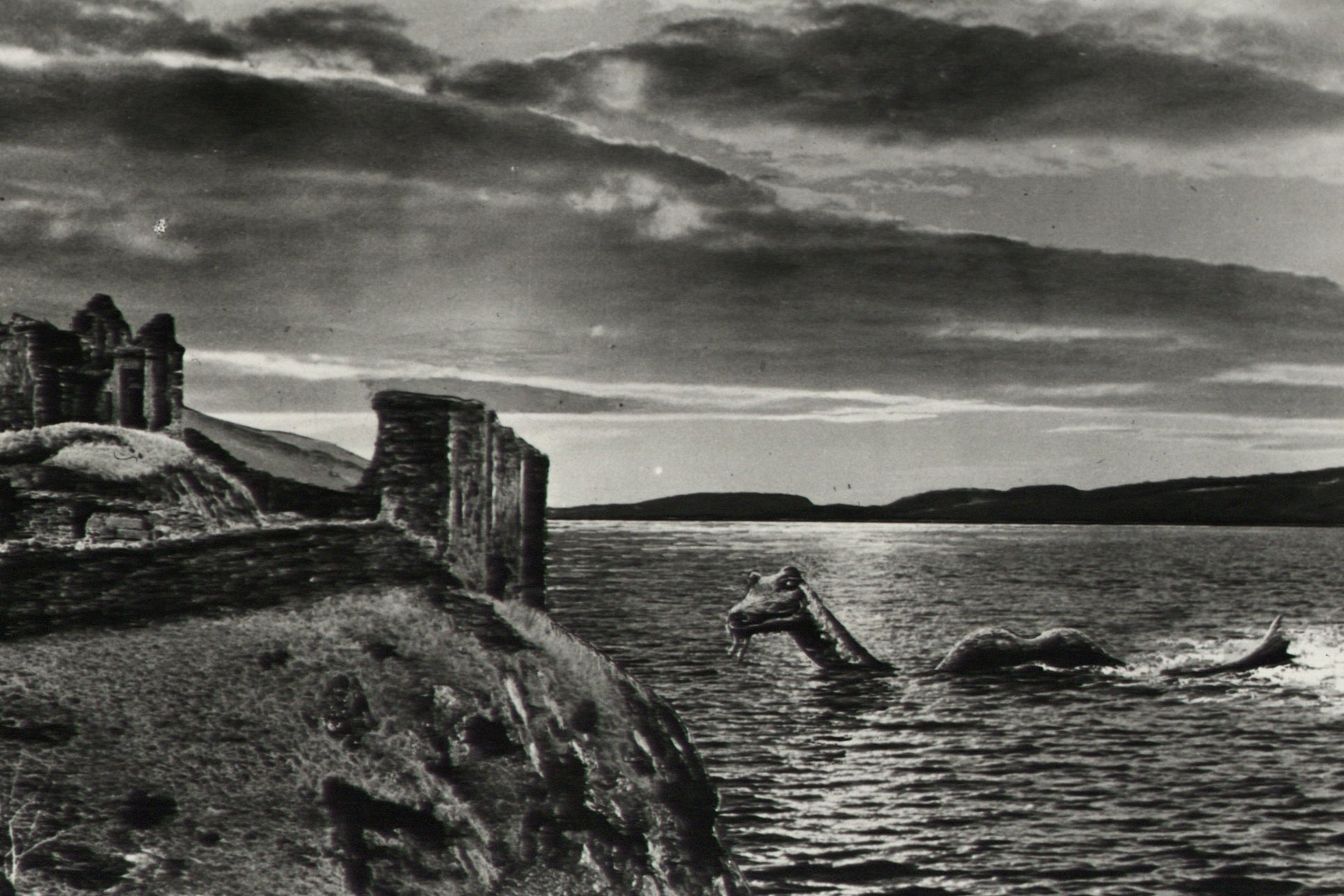 A drawing of the Loch Ness Monster swimming in freshwater near Urquhart Castle